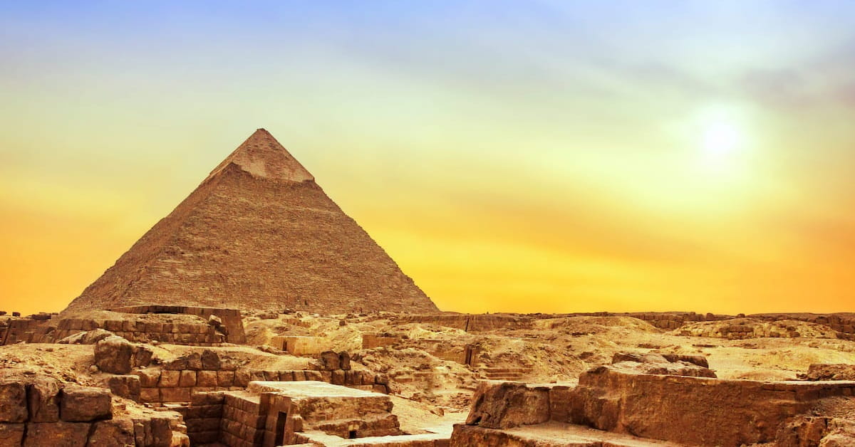 Picture of Giza pyramid with sunset in the back