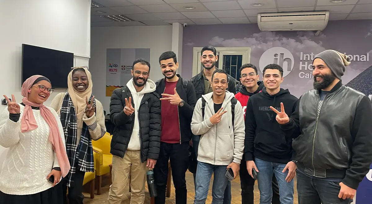 Students Smiling And Taking A Group Photo With Their Teacher At Ih Premises